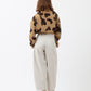 TWISTED TOP WITH BOW AND COW PRINT